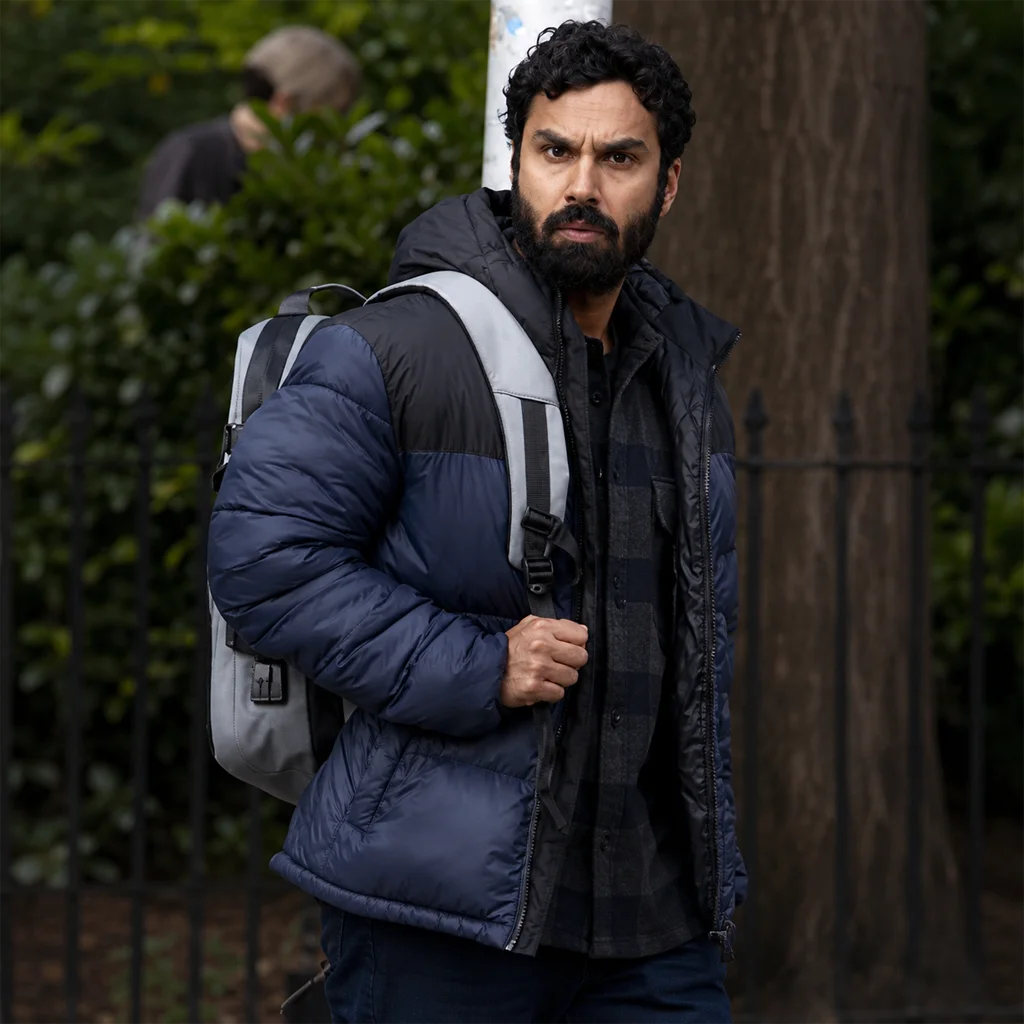 Aadesh Chopra Suspicion 2022 Kunal Nayyar Blue Puffer Jacket
